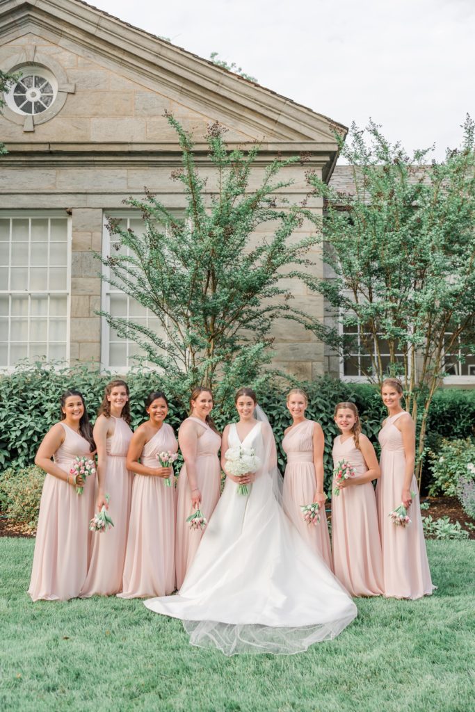 Bride and bridesmaids in pink bridesmaid dresses