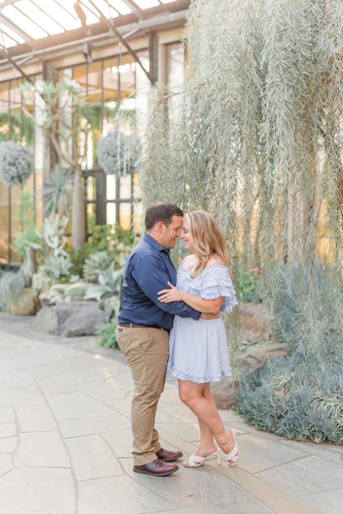 Philadelphia couple during engagement photos at Longwood Gardens