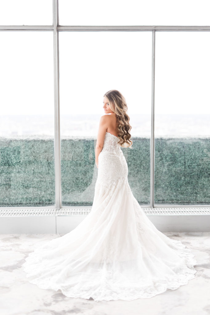 Photo of bride in lace wedding gown