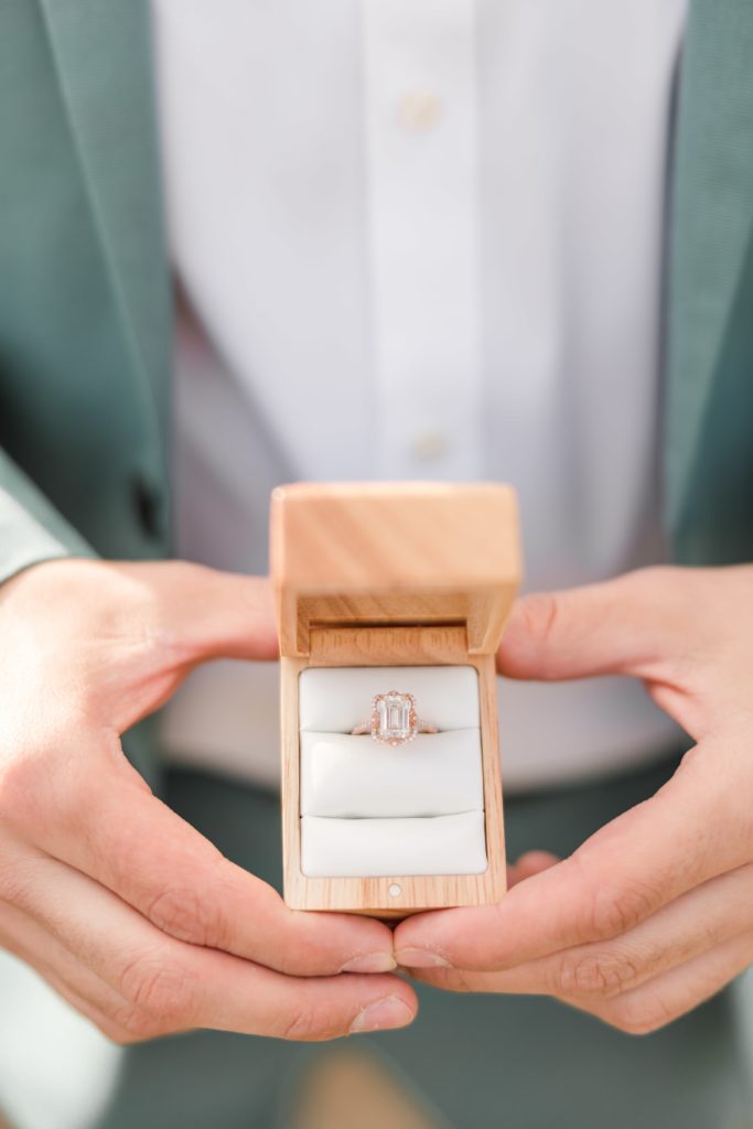 Guy holding wooden ring box