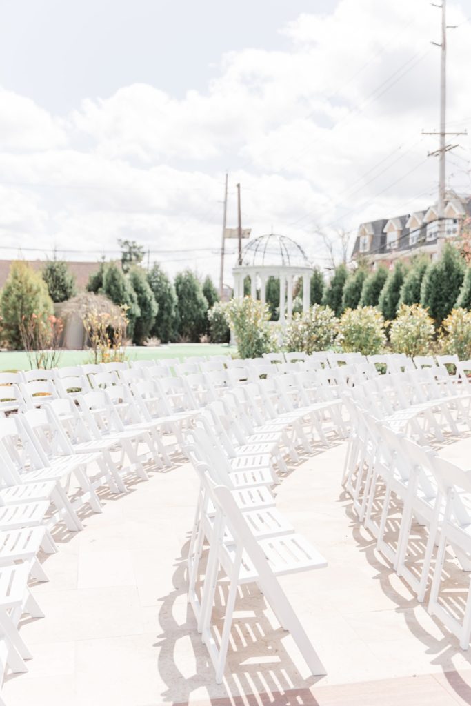 White chairs at wedding ceremony at The Grand