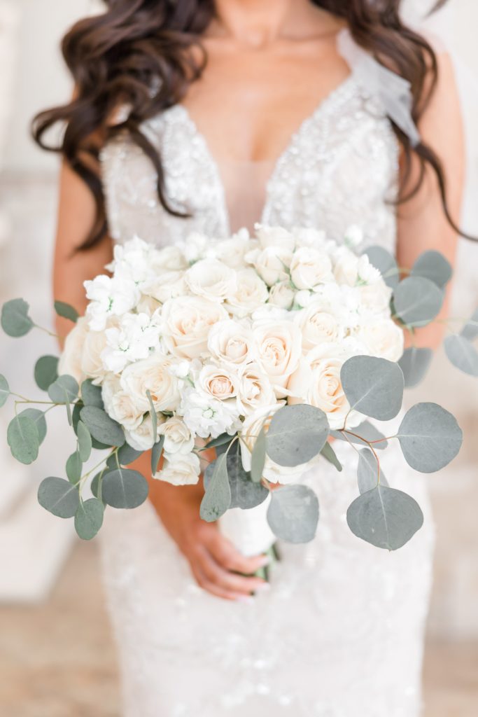Bride holding a white wedding bouquet