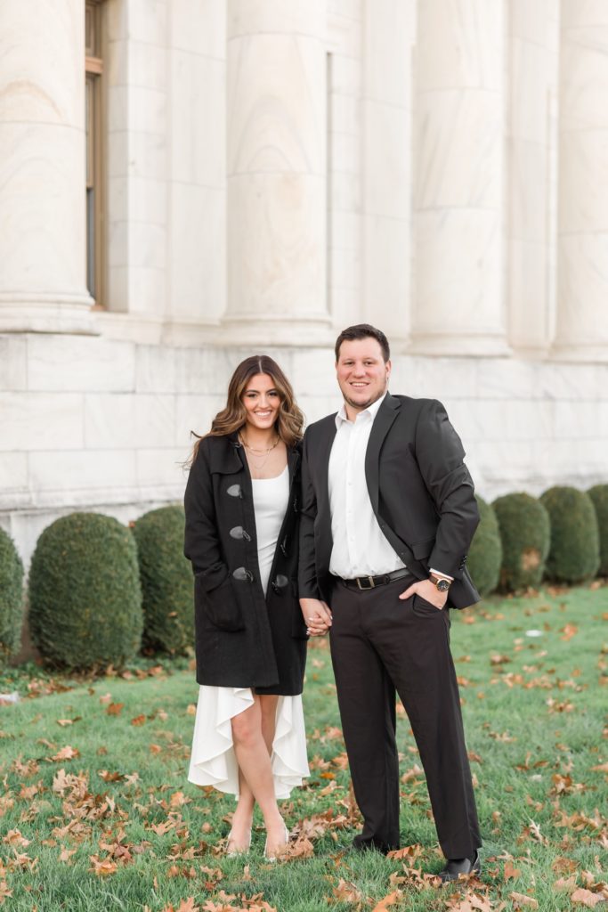 Couple in black jackets during engagement photos at Delware County Courthouse