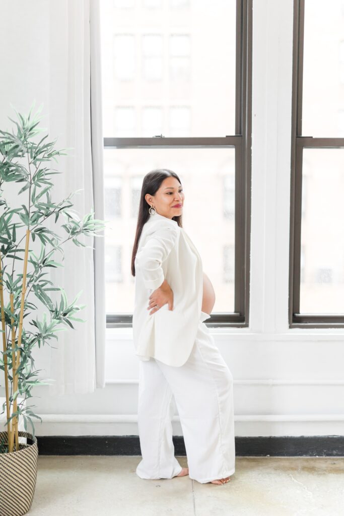 pregnant lady dressed in white blazer & pants