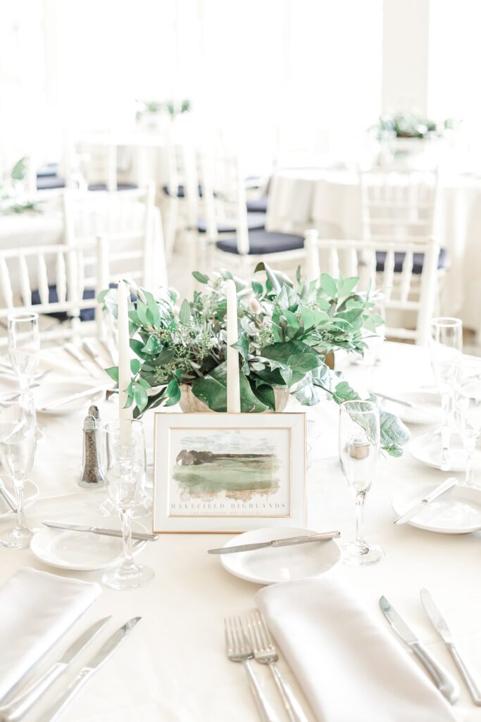 White wedding table with watercolor table numbers