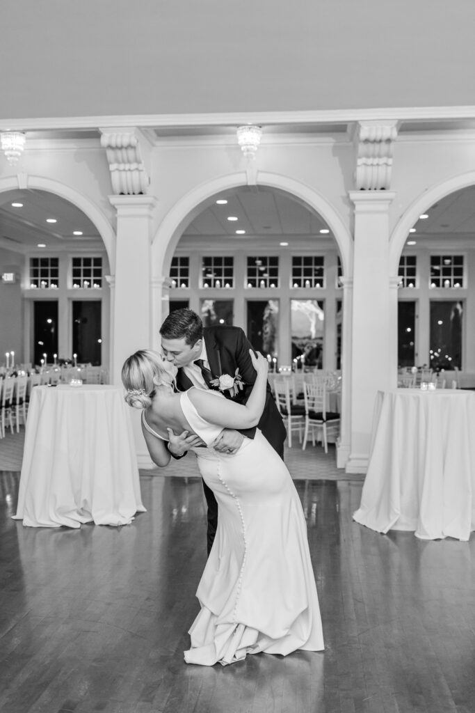 Black and white of bride and groom dancing