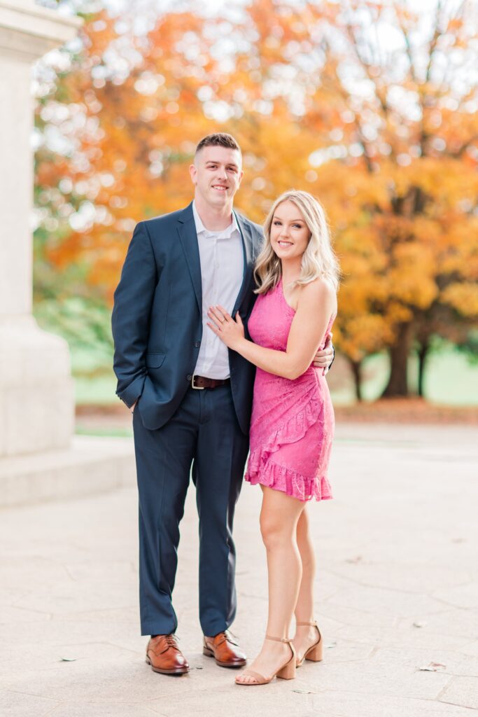 Girl in pink dress with guy in suit