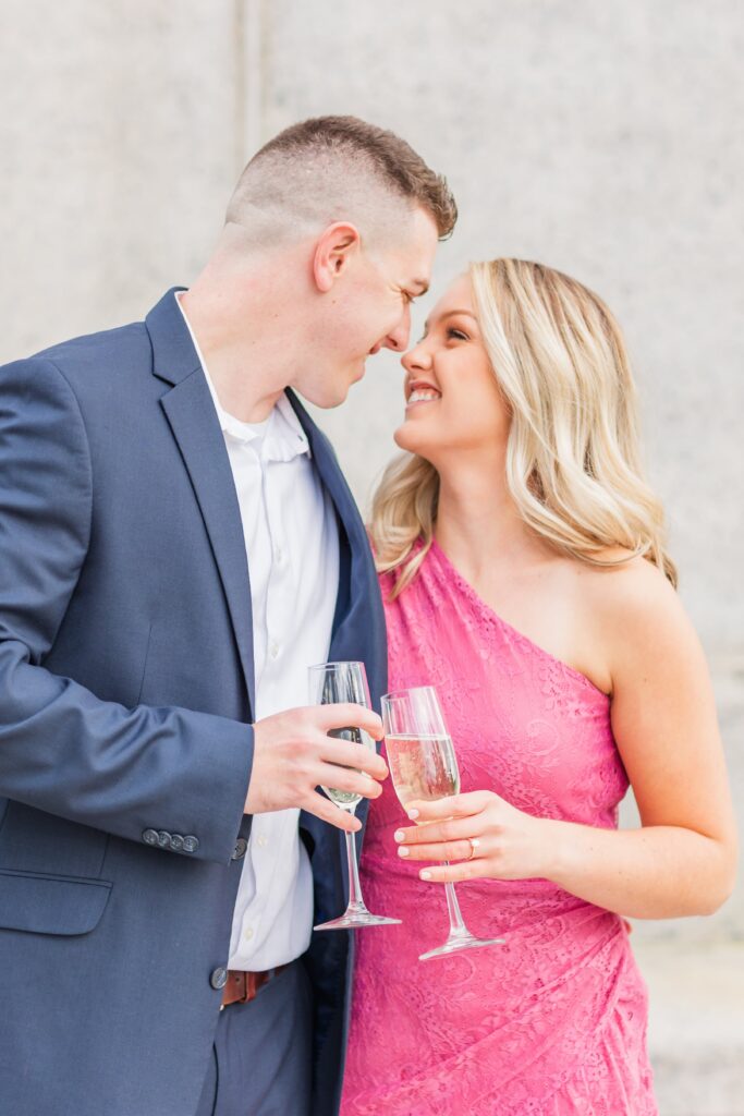 Newly engaged couple with champagne