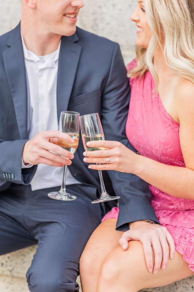 Newly engaged couple with champagne