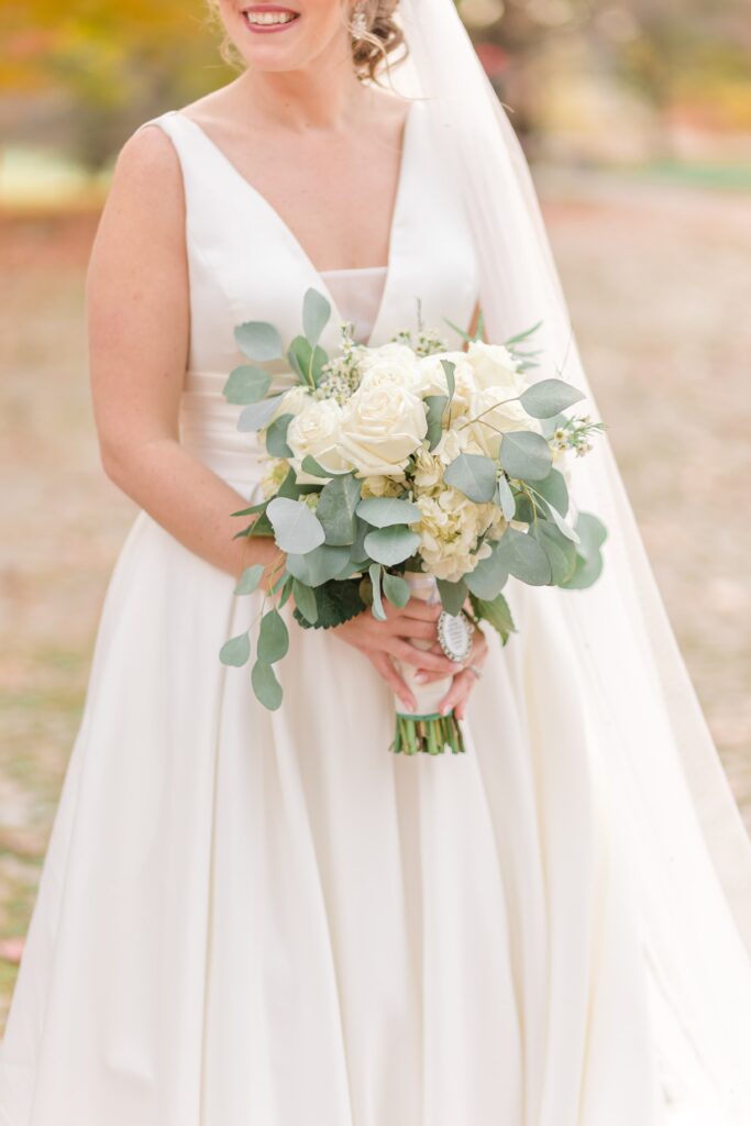 Bride holding white bridal bouquet