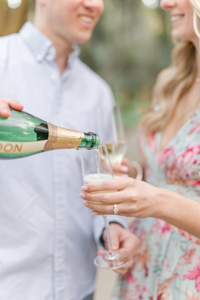 Engaged couple with champagne