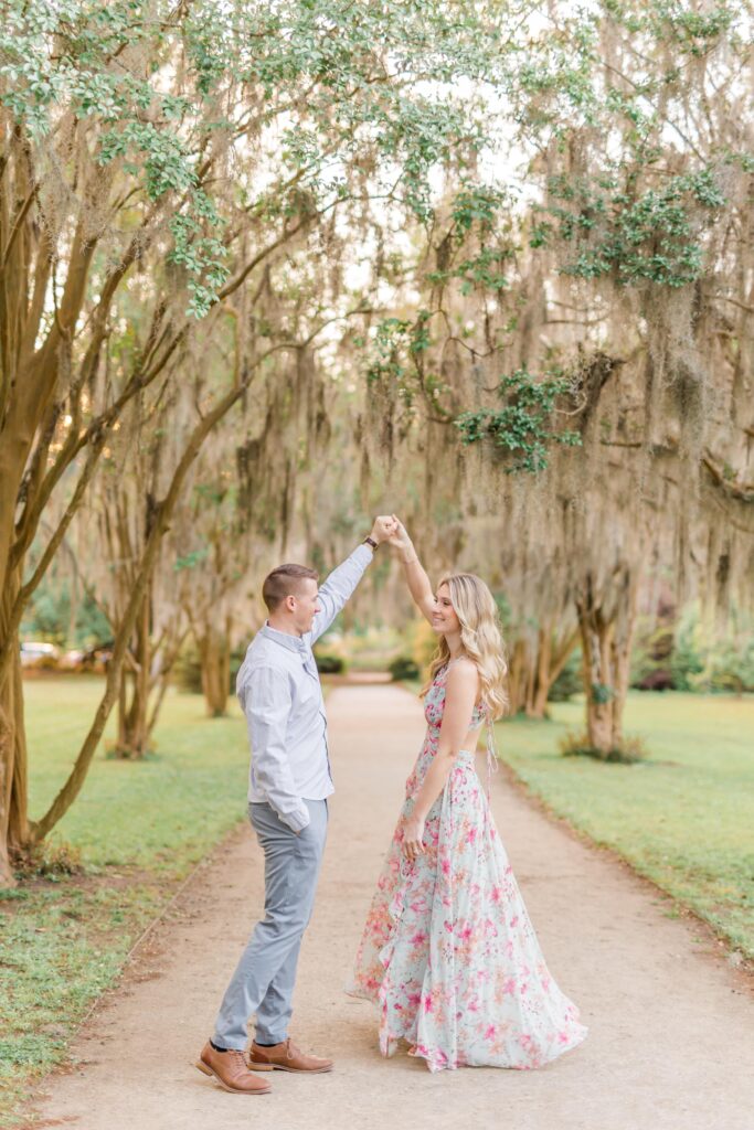 Engaged couple dancing under spanish moss
