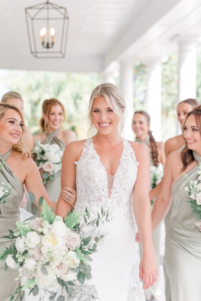 Bride with bridesmaids in green dresses