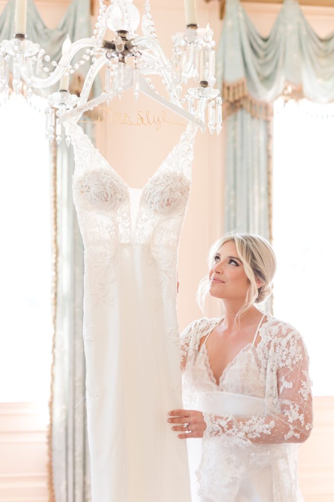 Bride with wedding dress in lace robe