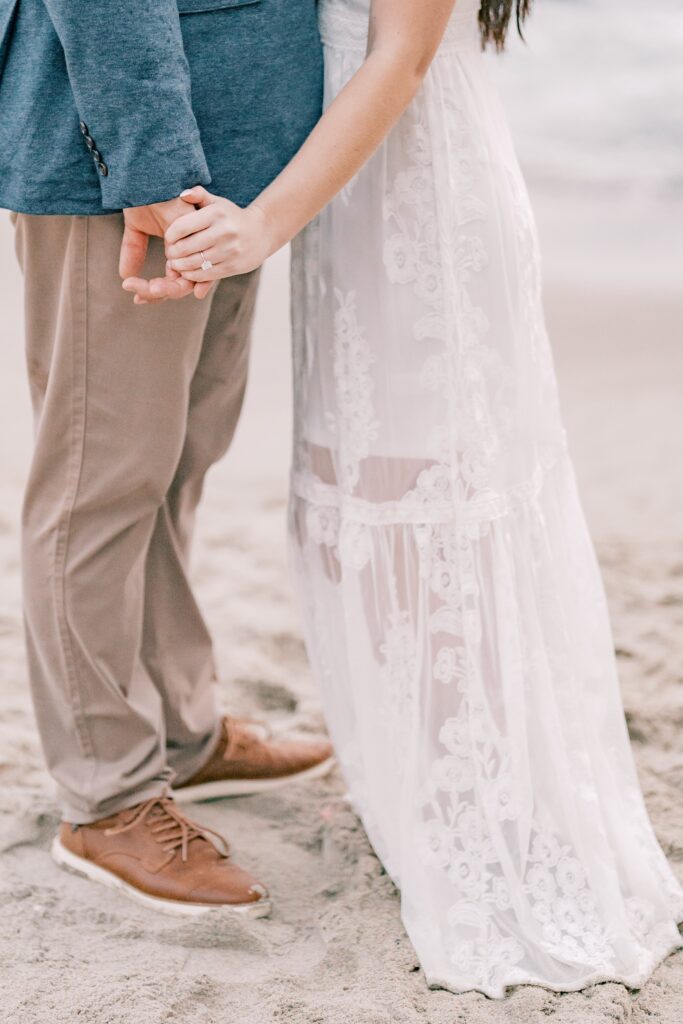 Engagement portrait of couple on the beach